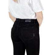 Black skinny jeans featuring a sleek slim-fit cut with subtle stitching details in high-quality denim material