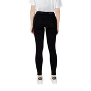 Black skinny jeans featuring a sleek, form-fitting design and high-waisted fit in a solid black color