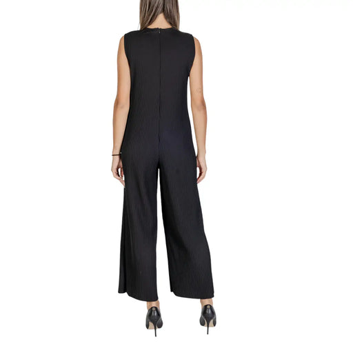 Black sleeveless polyester jumpsuit with zipper featuring pleated design and wide-leg pants for elegant wear