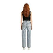 Light-wash denim jeans with high-rise waist and straight-leg cut paired with black sleeveless zip cardigan for women