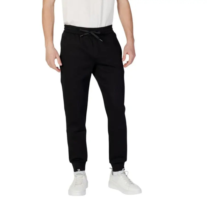 Black drawstring sweatpants from Armani Exchange Men featuring a plain design