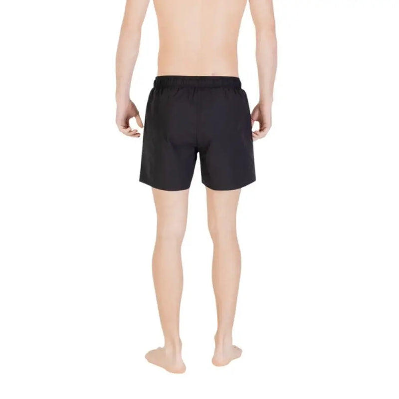 Black swim trunks displayed for men’s swimming and beachwear fashion