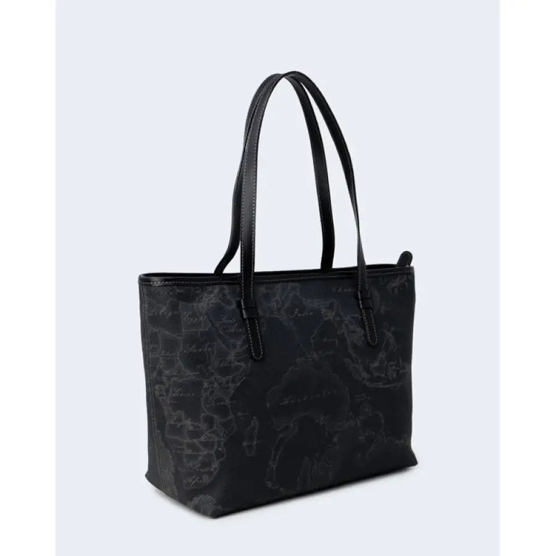 Black tote bag featuring a detailed world map pattern for travel enthusiasts