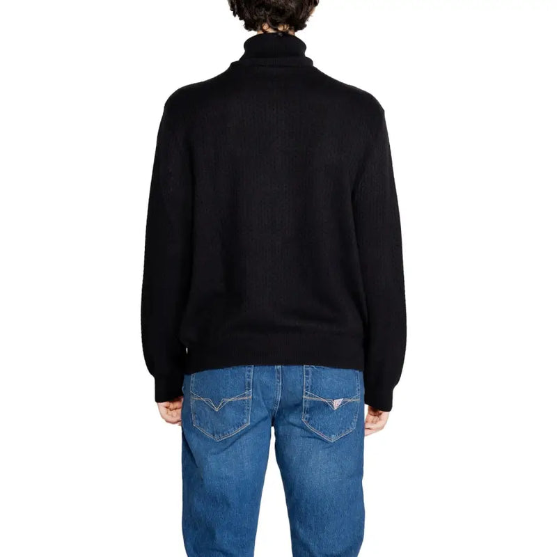 Black ribbed knit turtleneck sweater by Armani Exchange featuring long sleeves and a fitted silhouette