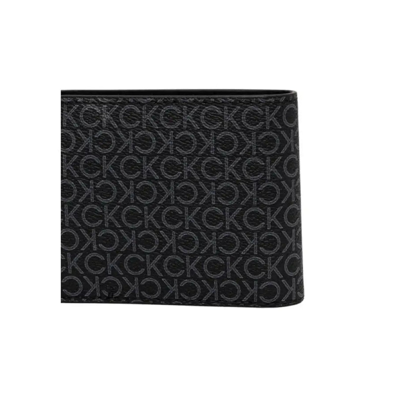 Open black leather wallet with Calvin Klein pattern displaying premium craftsmanship