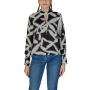 Black and white geometric patterned blouse by Jacqueline De Yong with long sleeves and keyhole neckline