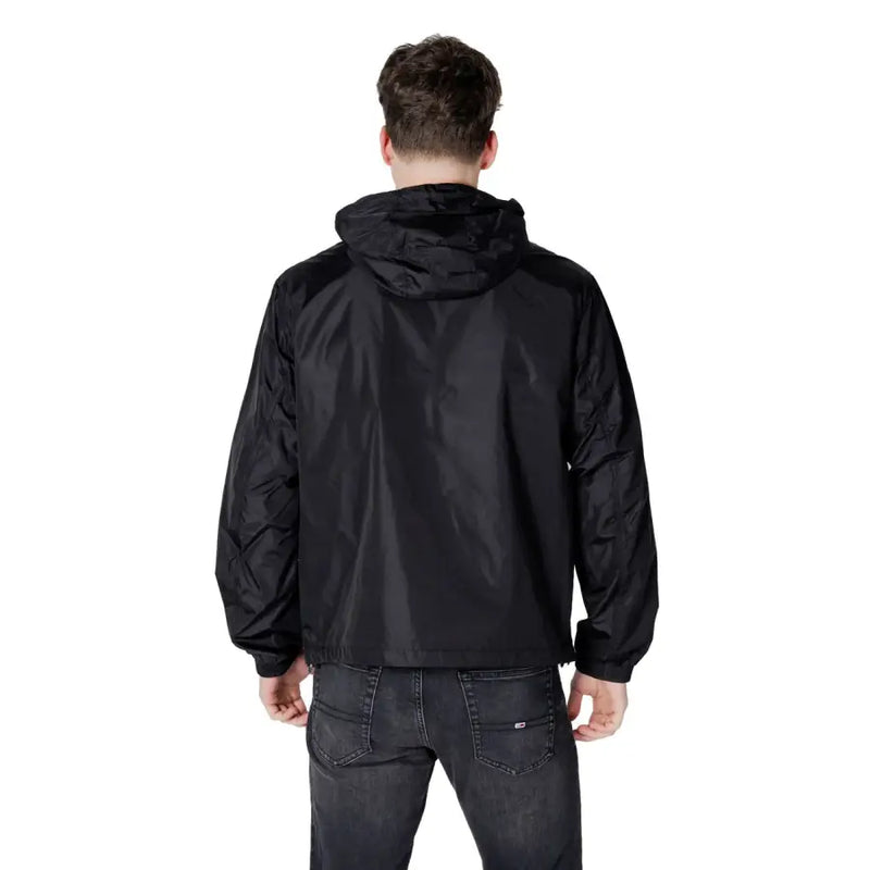 Men’s black hooded windbreaker jacket with dark grey jeans from Armani Exchange