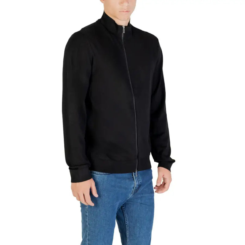 Black zip-up jacket with ribbed cuffs and waistband, made of cotton blend.