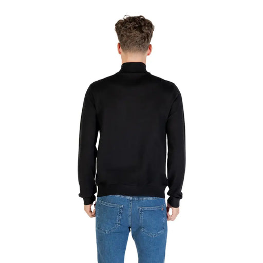 Black turtleneck sweater with ribbed cuffs and hem, made of soft cotton