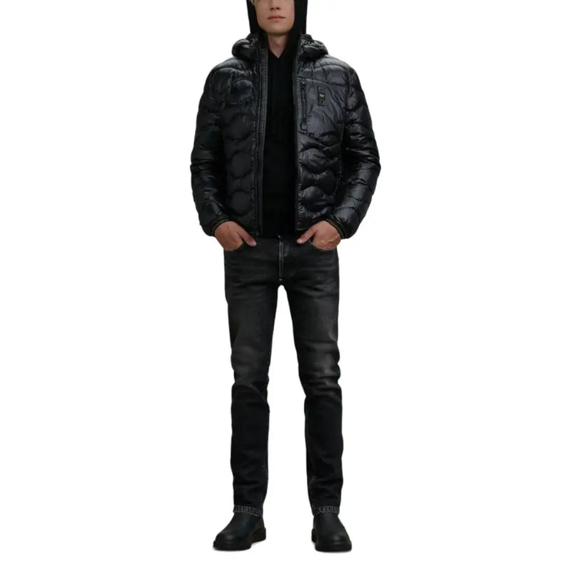 Black quilted puffer jacket with hood and zipper closure, likely from a popular brand known for outerwear.