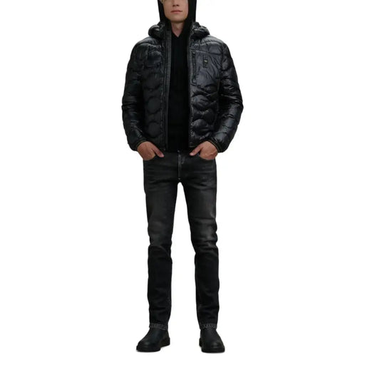 Black quilted puffer jacket with hood and zipper closure, likely from a popular brand known for outerwear.