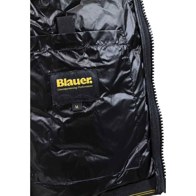 Blauer puffer jacket for men in black with shiny quilted interior and yellow brand label, detail view