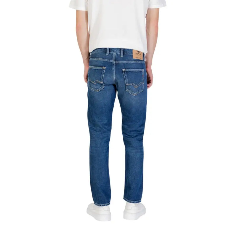 Blue denim jeans displayed with white sneakers on a product page
