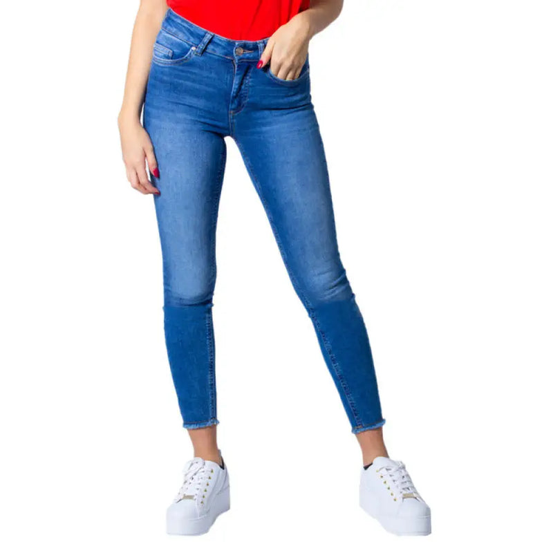 Blue denim skinny jeans displayed on a retail website showcasing stylish apparel