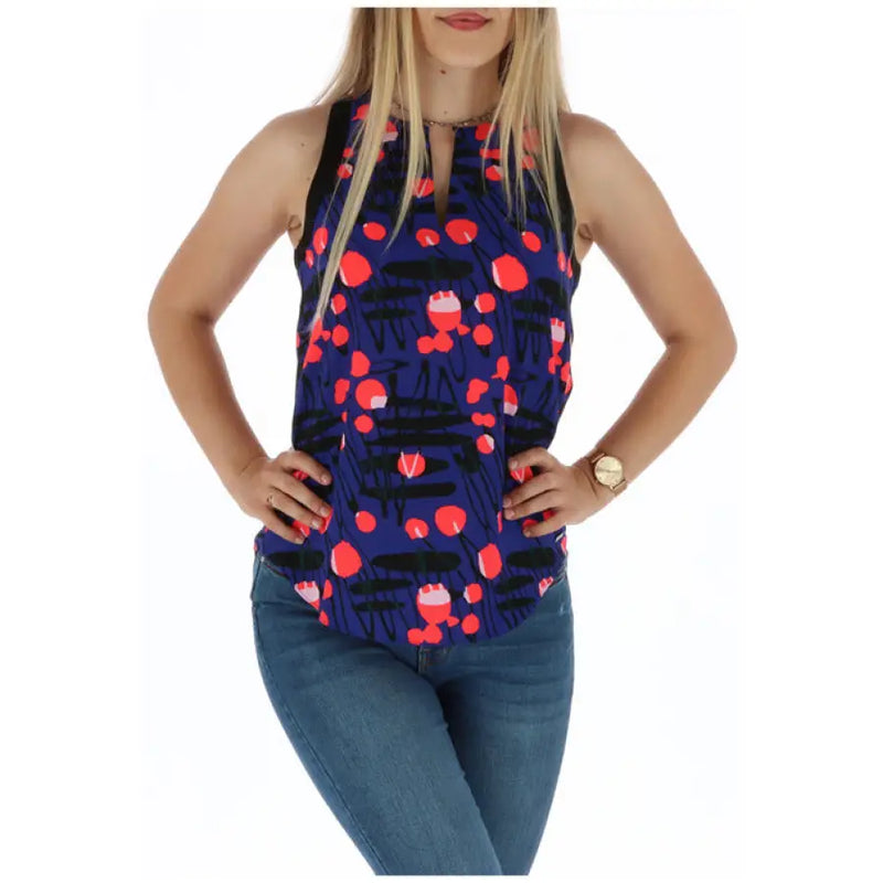 Blue sleeveless top featuring a red and black patterned design suitable for casual wear