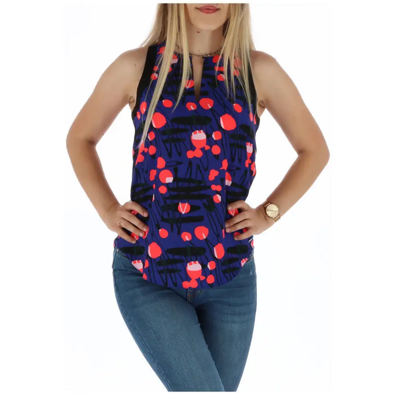 A navy blue sleeveless top featuring a playful red and black abstract pattern for casual wear