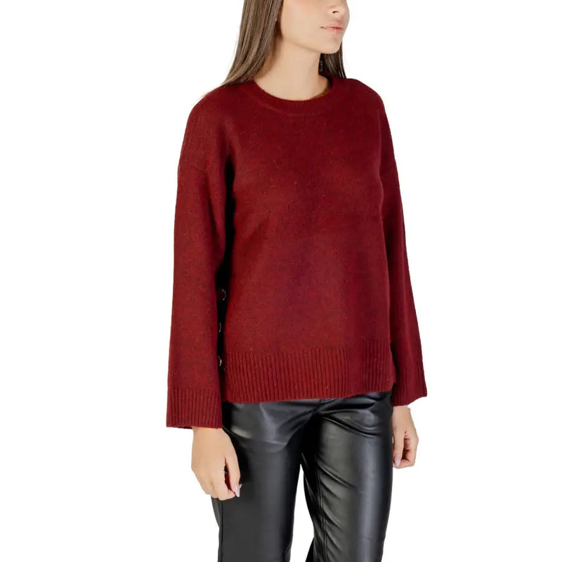 Women wearing Bordeaux dark red crew-neck knitwear with long sleeves and black faux leather pants