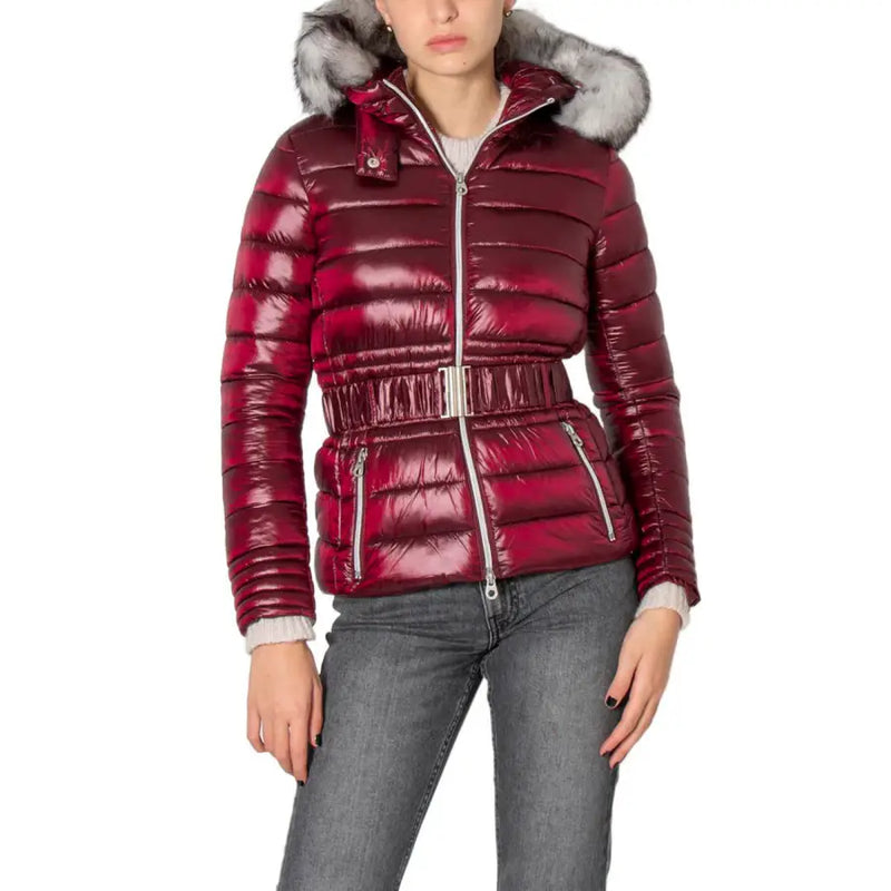 Bordeaux women’s shiny quilted burgundy puffer jacket with silver-toned belt and fur-lined hood