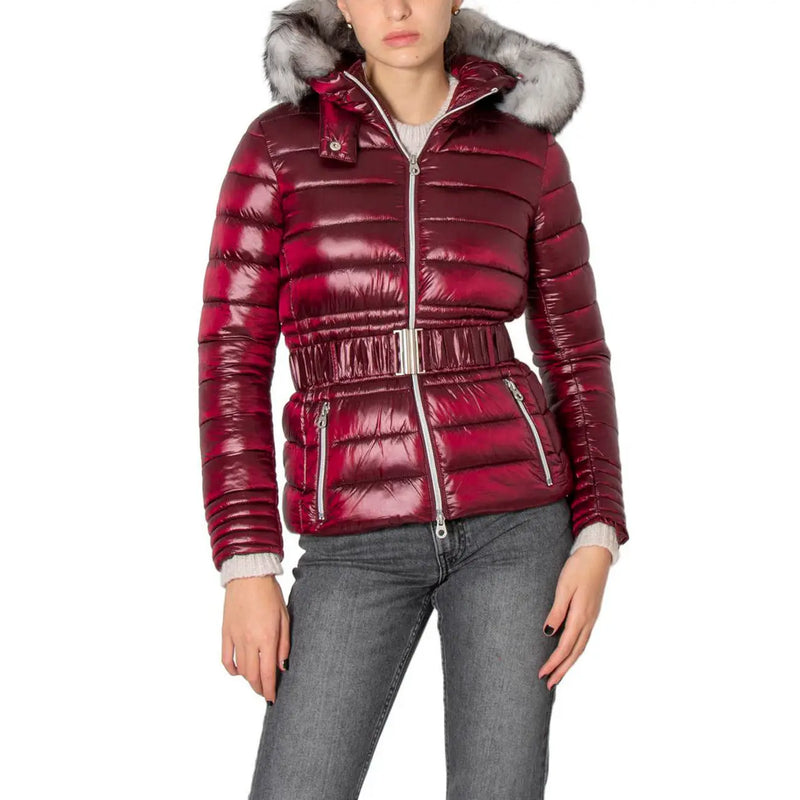 Bordeaux women’s shiny quilted burgundy puffer jacket with silver-toned belt and fur-lined hood