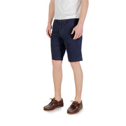Navy blue chino shorts with brown leather boat shoes and white t-shirt.