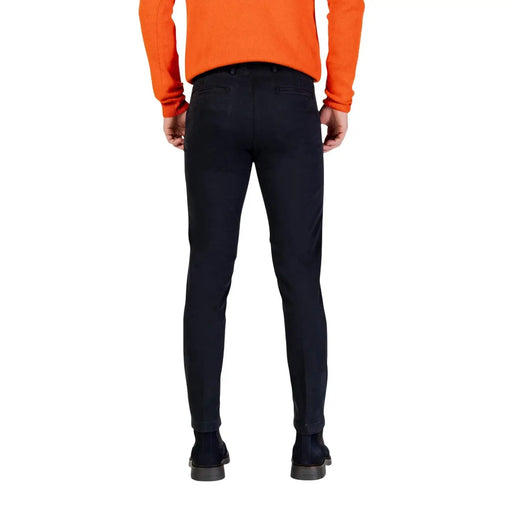 Black slim-fit Borghese men trousers with smooth tailored fabric and classic back pockets shown from the back side