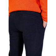 Navy blue textured Borghese men trousers in chinos style with back pocket and tapered leg cut shown from the back side