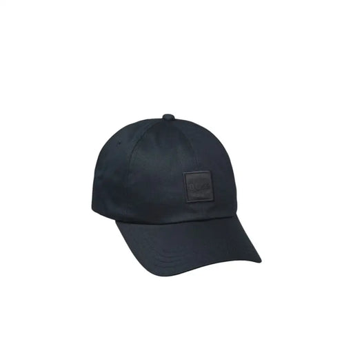 Black baseball cap with a square patch on the front, made of nylon material.