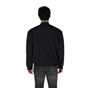 Blouson aviateur noir pour homme Boss, avec poignets et ourlet côtelés, en coton et polyamide, idéal pour un style décontracté.