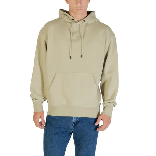 Men’s light green cotton hooded sweatshirt with front pockets and blue jeans