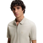 Beige boss men polo shirt in cotton with short sleeves and zipper placket featuring a subtle brand logo patch