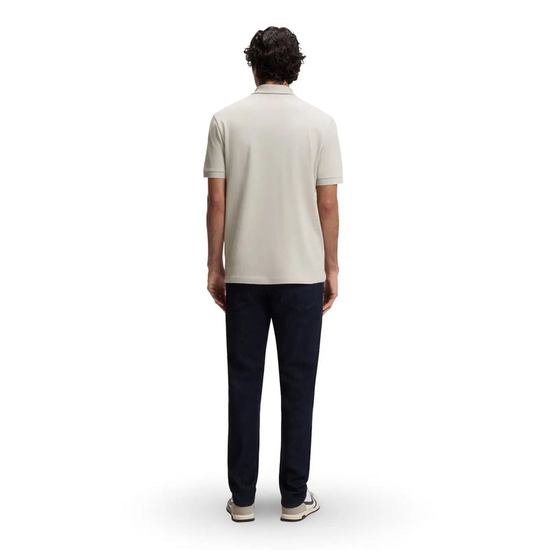 A man wearing a boss men polo shirt grey cotton zip neck short sleeve with a light beige classic collar and stitched seams
