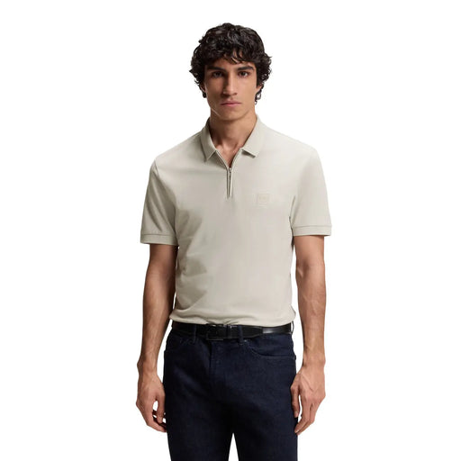 Beige boss men polo shirt with short sleeves, subtle textured fabric, small embroidered logo, and zip neck cotton design