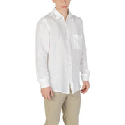 Men’s white long-sleeved linen button-up shirt with chest pocket paired with khaki pants