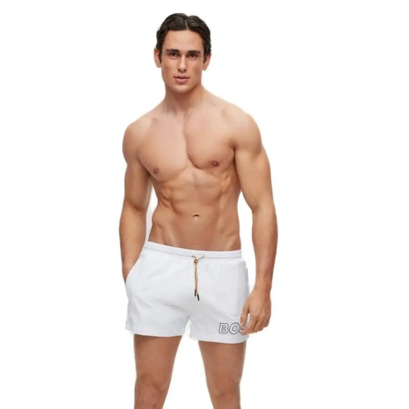 Weiße Herren-Badehose von Boss aus schwarzem Polyamid mit Schnürung, goldfarbenem Kordelzug und dezentem Logo am linken Bein.