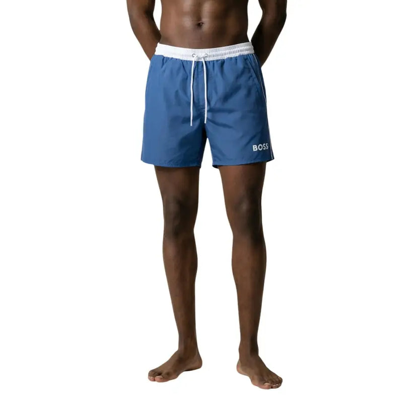 Blue boss men’s swim trunks with white elastic waistband and drawstring designed for swimwear use