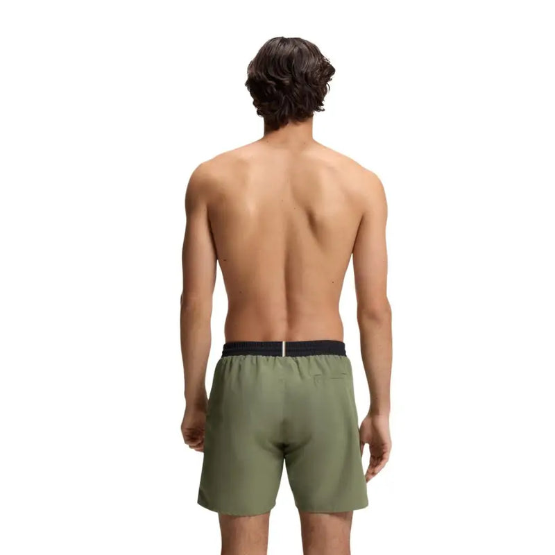 Olive green boss men swimwear athletic shorts with black elastic waistband designed for swimming and active use