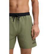 Boss men swimwear olive green swim trunks with black elastic waistband drawstring and boss logo embroidered on lower leg