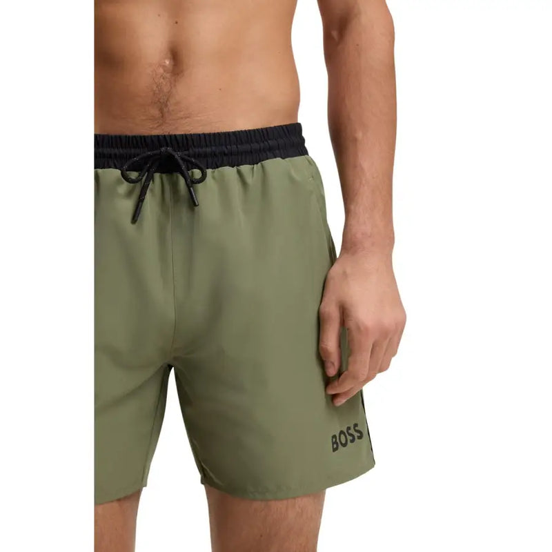 Boss men swimwear olive green swim trunks with black elastic waistband drawstring and boss logo embroidered on lower leg