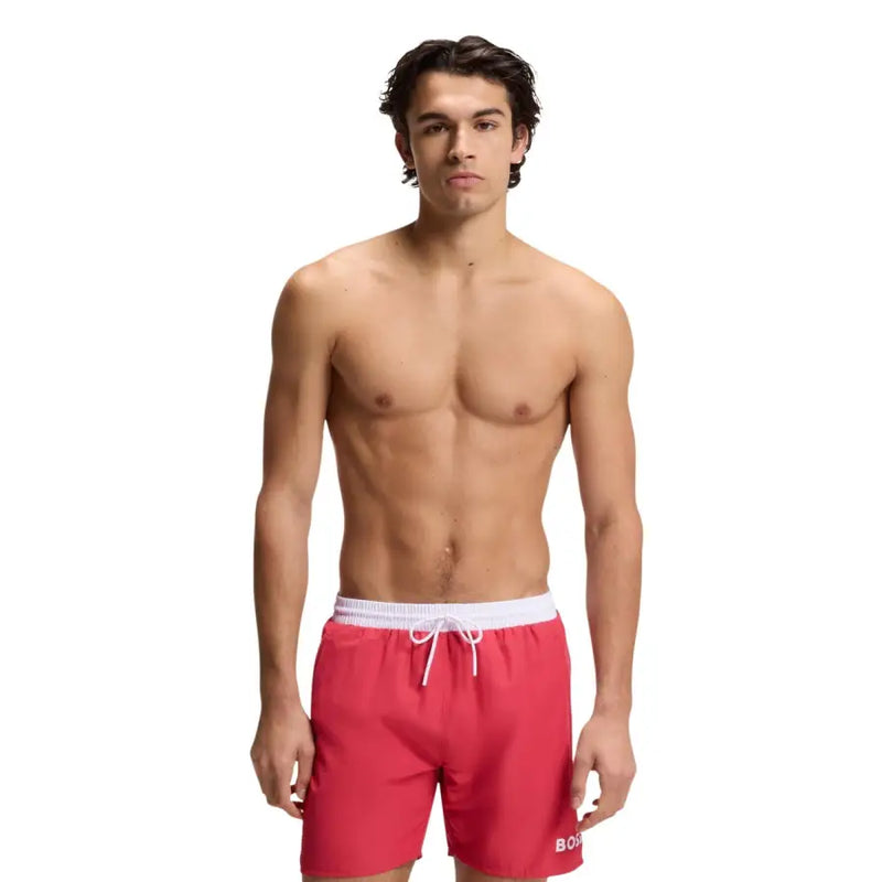 Red Boss men swimwear swim trunks with white elastic waistband and drawstring featuring boss logo on the lower right leg