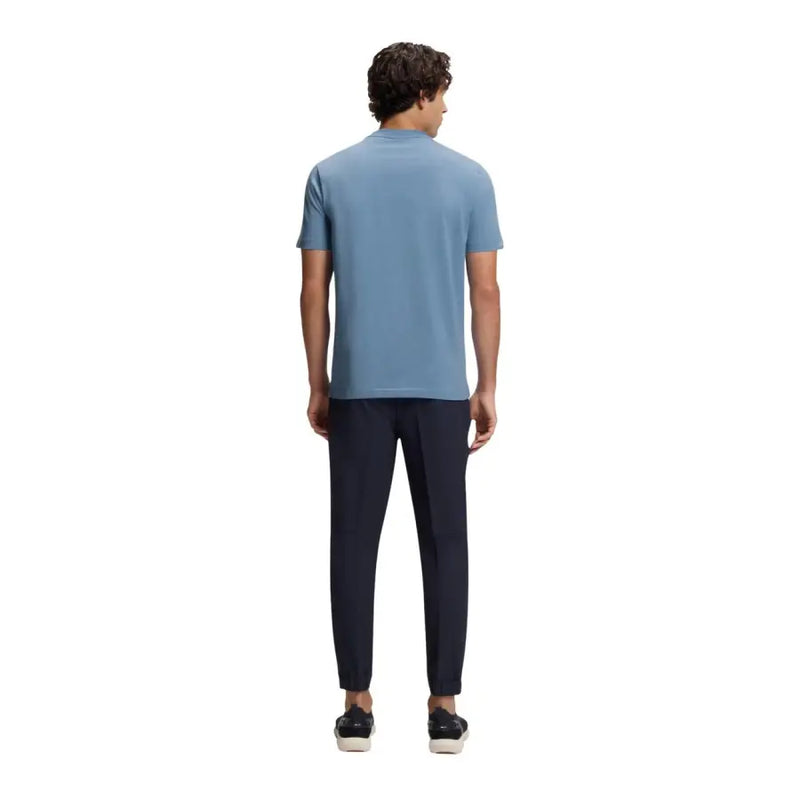 A man wearing a light blue boss men t shirt made of cotton stretch with short sleeves and crew neck