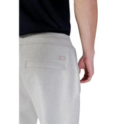 Back side of boss men trousers in light gray textured fabric joggers with a subtle woven label on the pocket