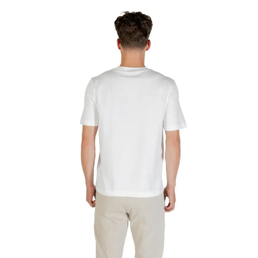Man wearing Boss Men White Cotton Elastane Round Neck T Shirt in plain white short-sleeved style