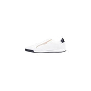 White puma slip-on sneaker with black accents and silver logo.
