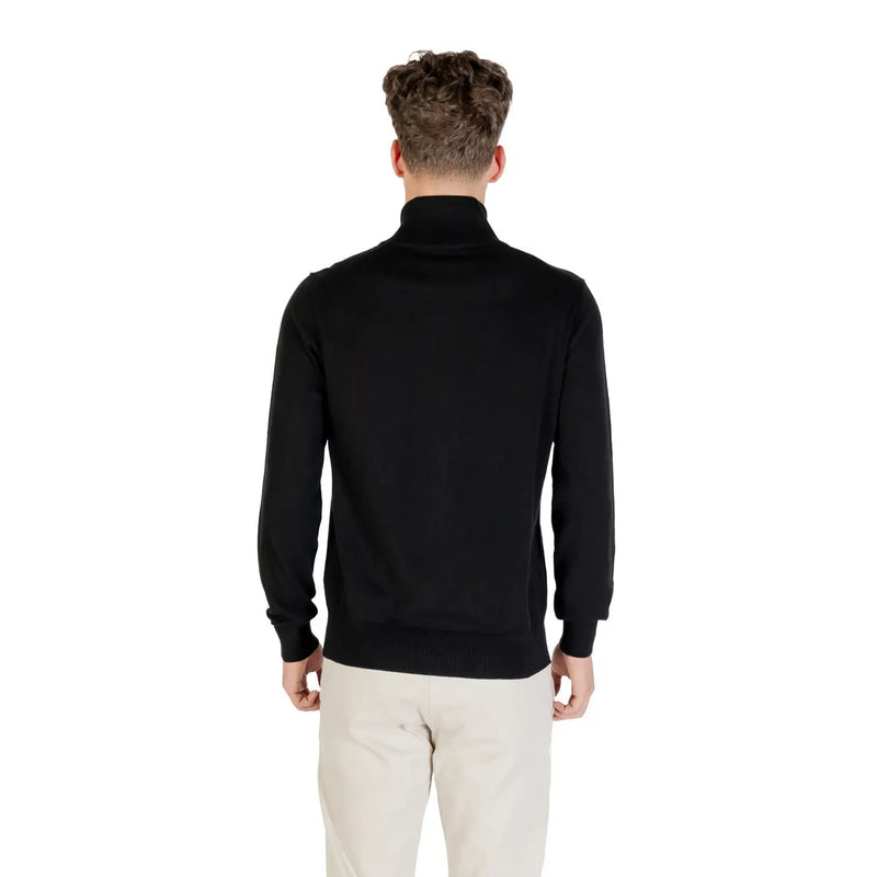 Boss wool turtleneck sweater for men in black with smooth fitted silhouette and ribbed cuffs, front view