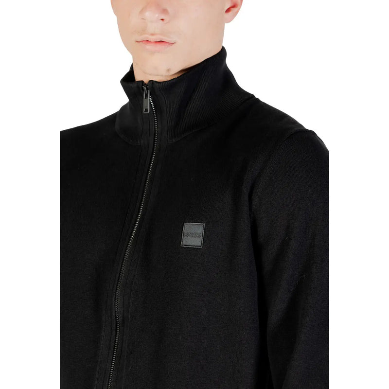 Boss wool turtleneck sweater for men in black with ribbed collar and subtle brand patch, front view