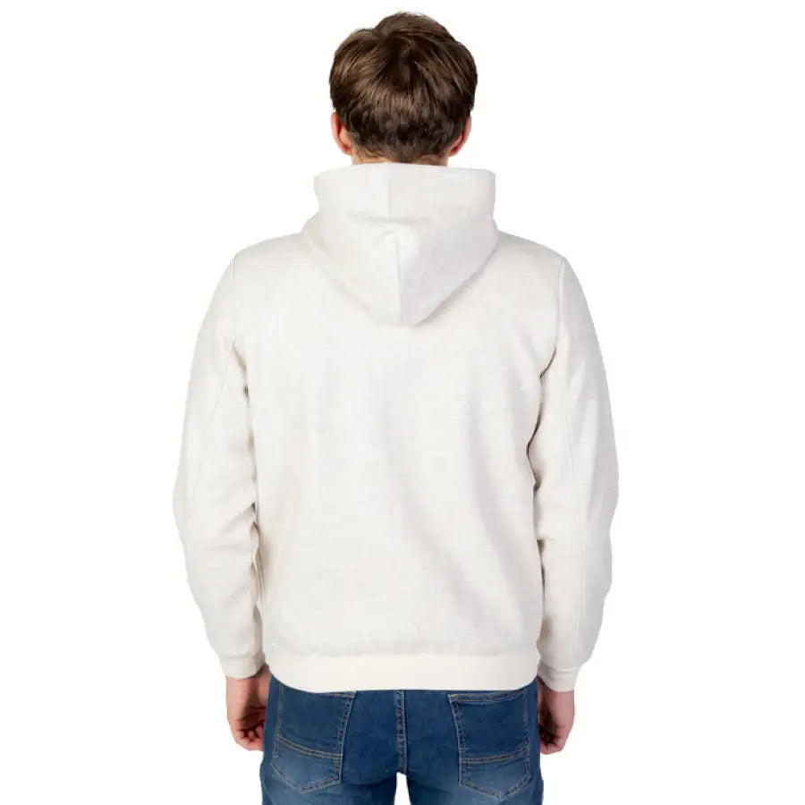 
                      
                        Boy in white hoodie showcasing U.S. Polo Assn. blazer for urban city fashion
                      
                    