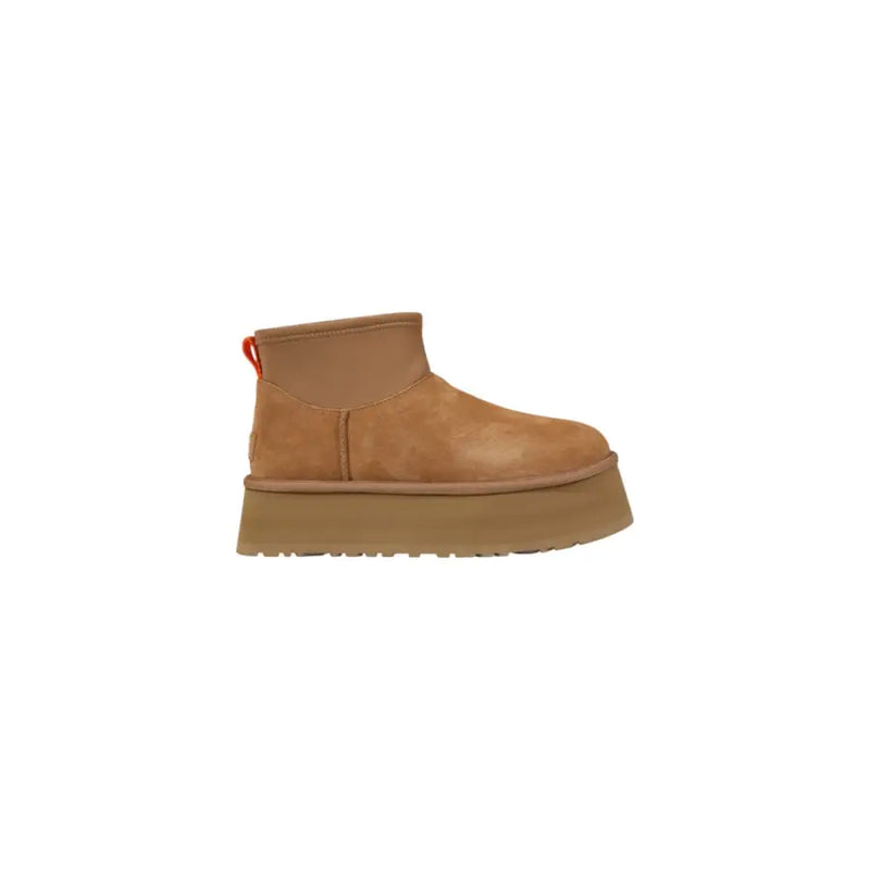 Brown platform UGG boot in tan suede with thick rubber sole and orange pull tab shown from the back side