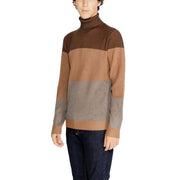 Brown and gray color-blocked turtleneck sweater with ribbed knit texture, likely made of wool or a similar material.
