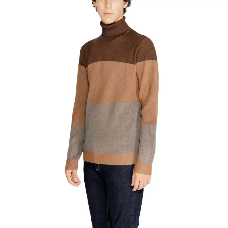 Brown and gray color-blocked turtleneck sweater with ribbed knit texture, likely made of wool or a similar material.