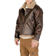 Brown shearling aviator jacket with zipper and pockets, likely from a popular aviation brand.